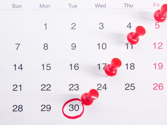 Calendar with pins marking dates, representing the rent grace period